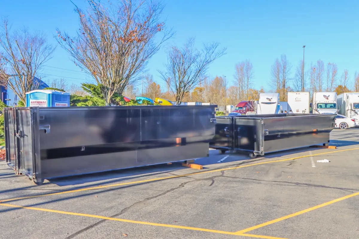 Professional dumpster rental service with roll-off container on residential driveway in Lutz